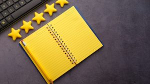 yellow notebook with review stars