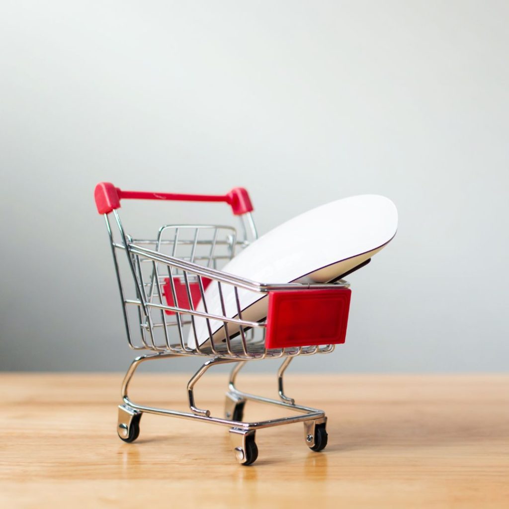 tiny shopping cart with computer mouse in it
