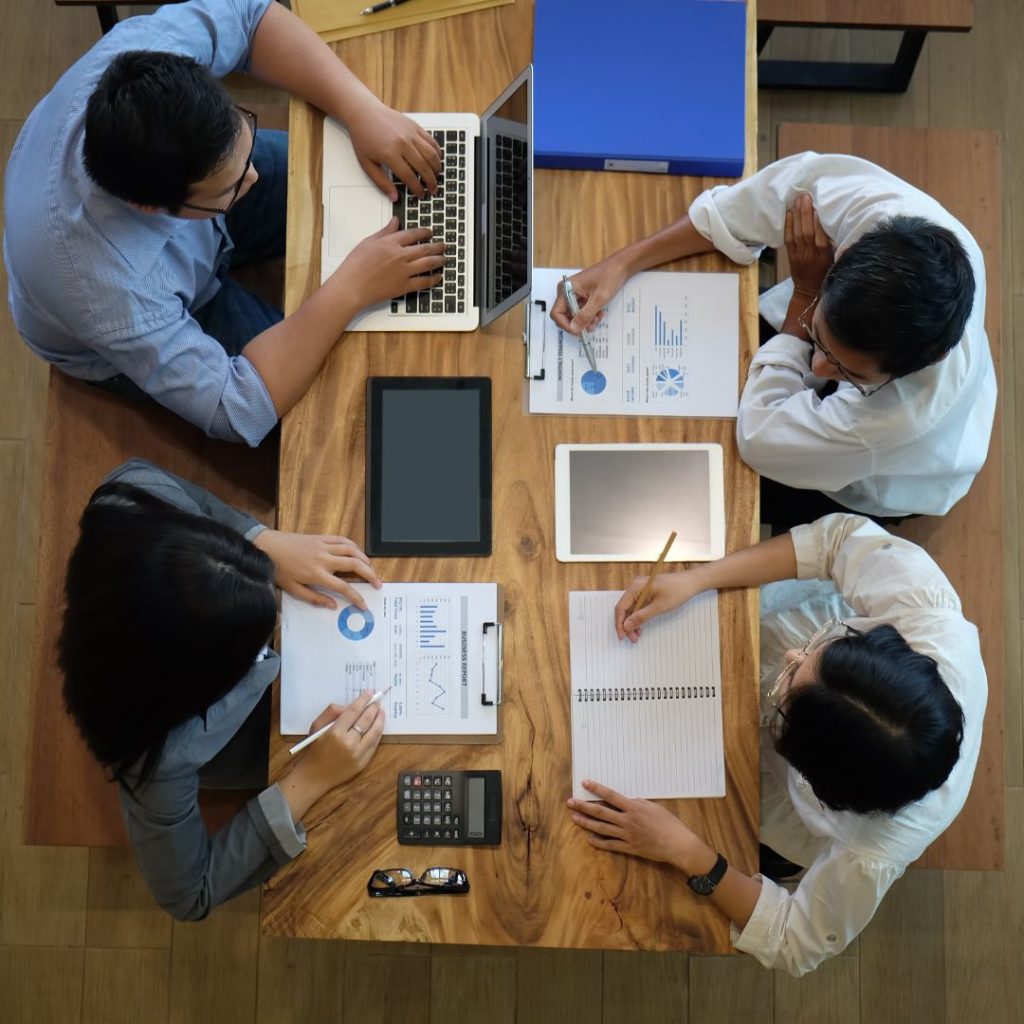 people working at a table together