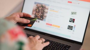 person using card to online shop