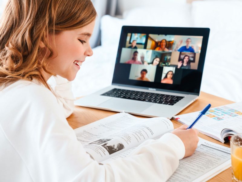 photo-of-girl-writing-in-exercise-book-while-study-YKQEK9Y.jpg