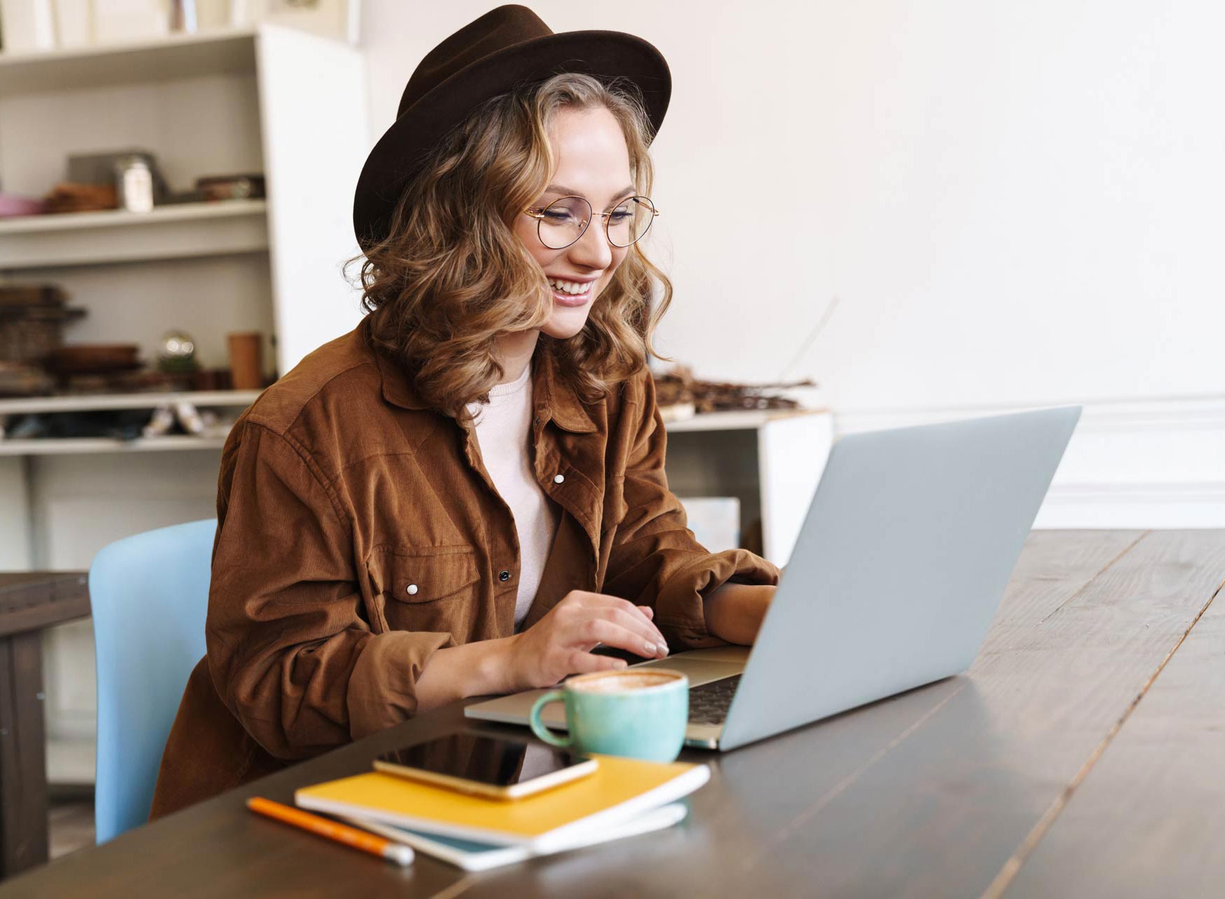 image-of-cheerful-woman-working-with-laptop-while-CNX4RJP.jpg